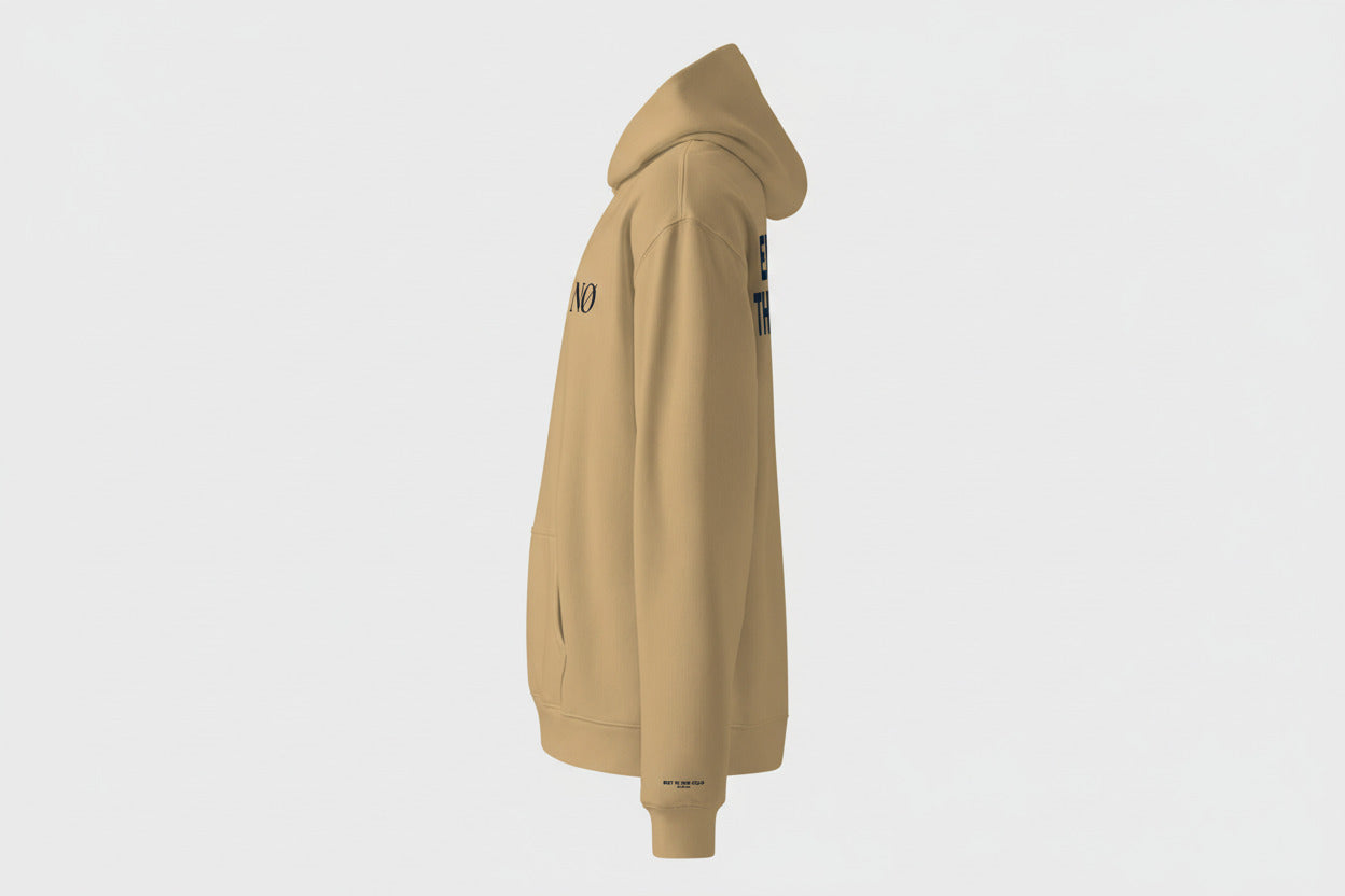 Side View Sand  Nørvael hoodie with "ENTER THE COLD" printed in sand on the back.